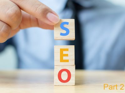 Search engine optimization concept. Hand putting wood block cube shape with word SEO